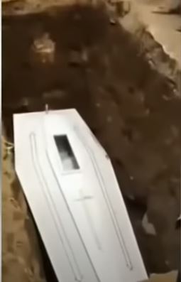 Corpse Appears To Wave Inside Coffin During Funeral